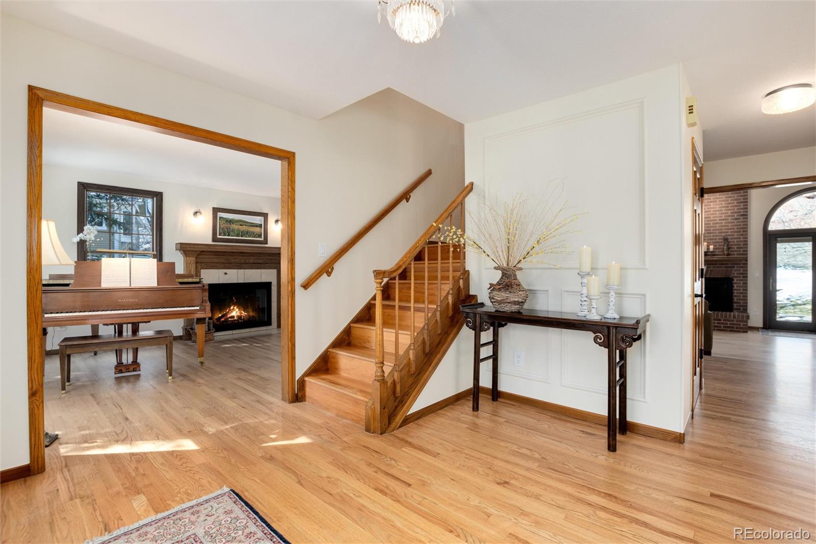 65 North Ranch Road Littleton, CO 80127 - Photo 38 of 44 a view of entryway and hall with wooden floor