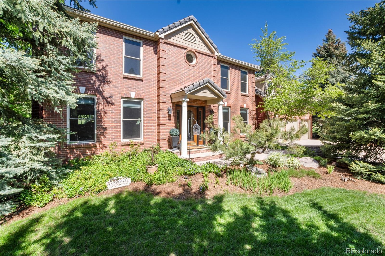 65 North Ranch Road Littleton, CO 80127 - Photo 44 of 44 a front view of a house with a yard