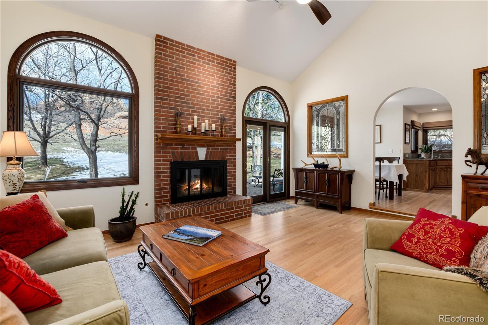 65 North Ranch Road Littleton, CO 80127 - Photo 5 of 44 a living room with furniture fireplace and a large window