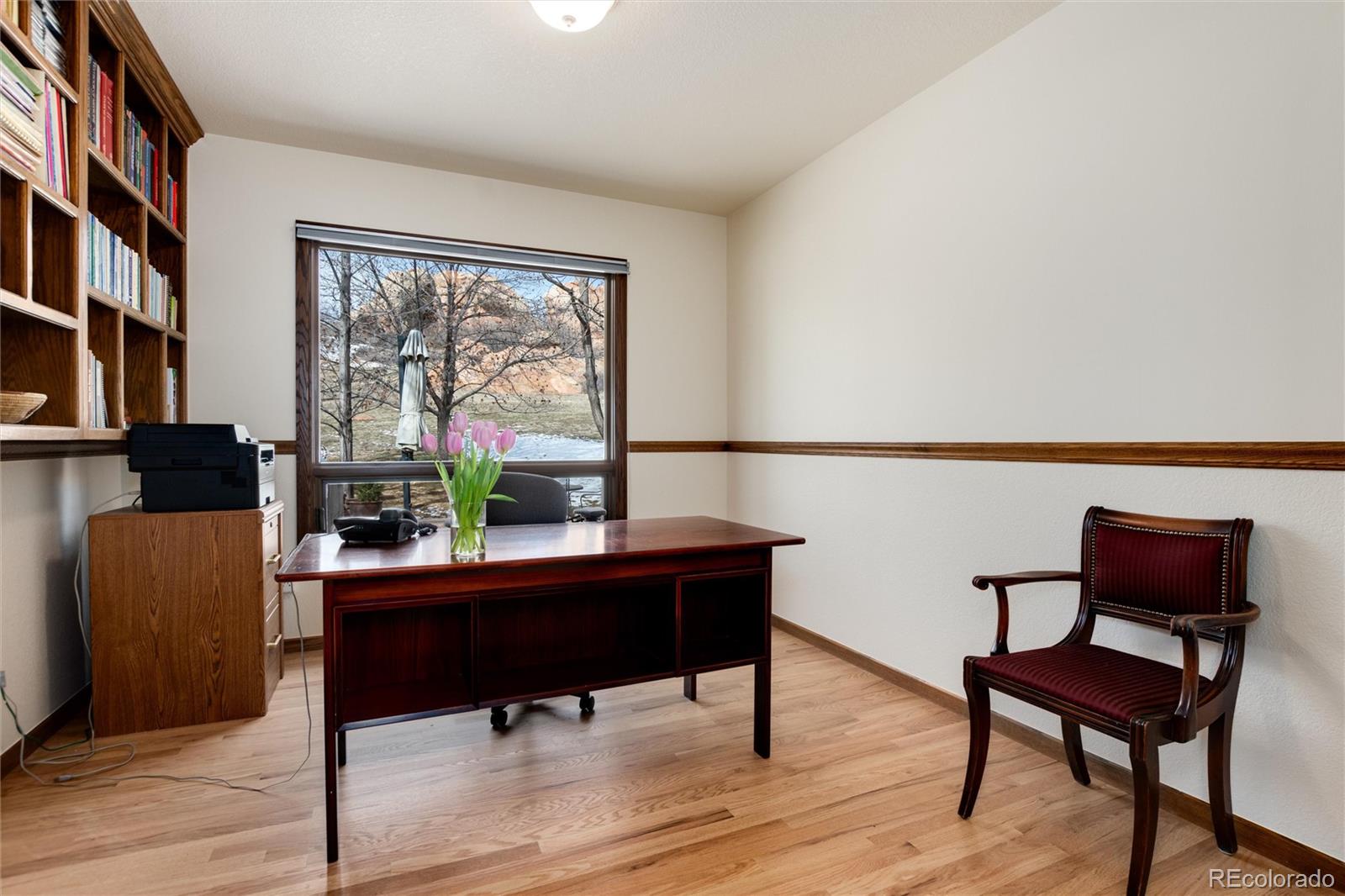 65 North Ranch Road Littleton, CO 80127 - Photo 6 of 44 a living room with furniture and a potted plant next to a window