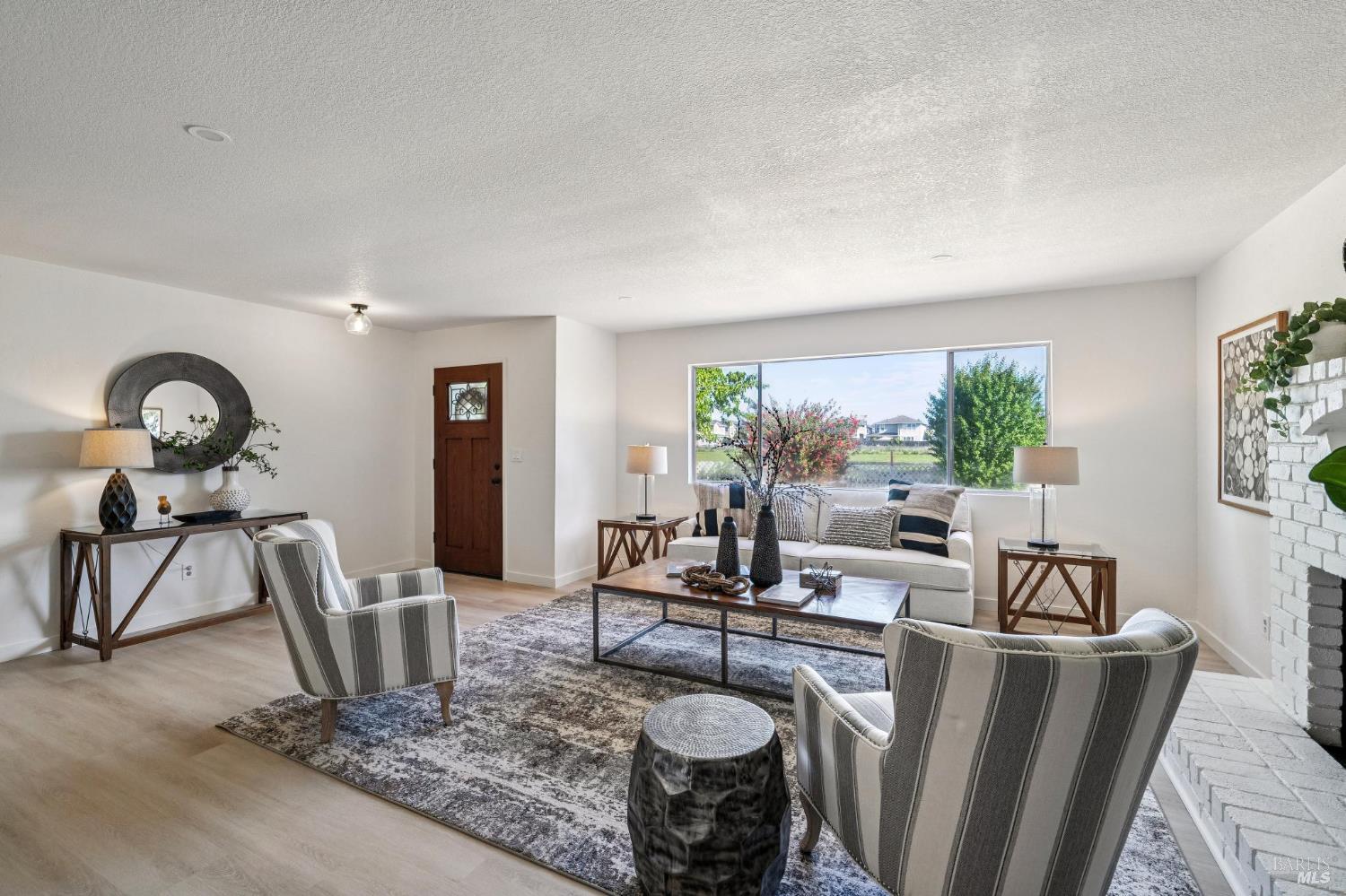 2295 Francisco Avenue, Unit 1 Santa Rosa, CA 95403 - Photo 11 of 65 a living room with furniture rug and a large window