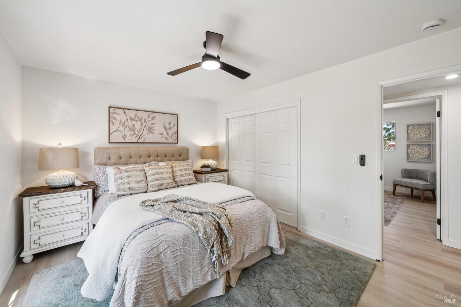 2295 Francisco Avenue, Unit 1 Santa Rosa, CA 95403 - Photo 24 of 65 a bedroom with a bed and wooden floor