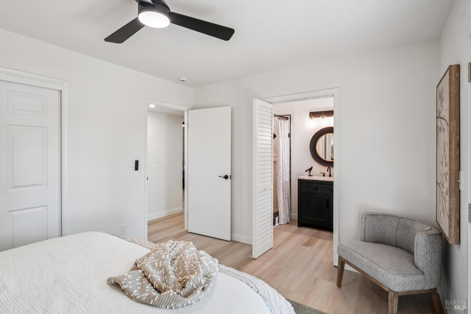 2295 Francisco Avenue, Unit 1 Santa Rosa, CA 95403 - Photo 25 of 65 a bedroom with a bed and chandelier