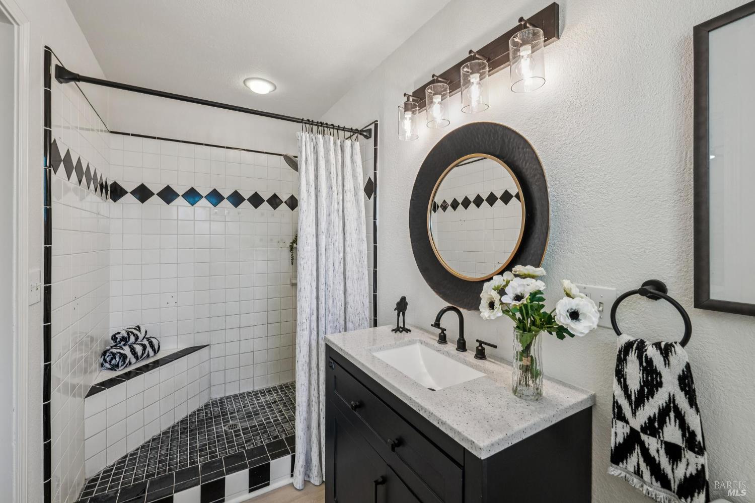 2295 Francisco Avenue, Unit 1 Santa Rosa, CA 95403 - Photo 27 of 65 a bathroom with a sink and a mirror