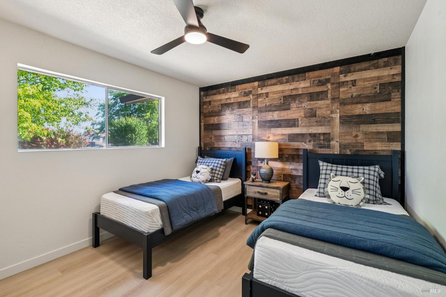 2295 Francisco Avenue, Unit 1 Santa Rosa, CA 95403 - Photo 28 of 65 a bedroom with two beds and a large window