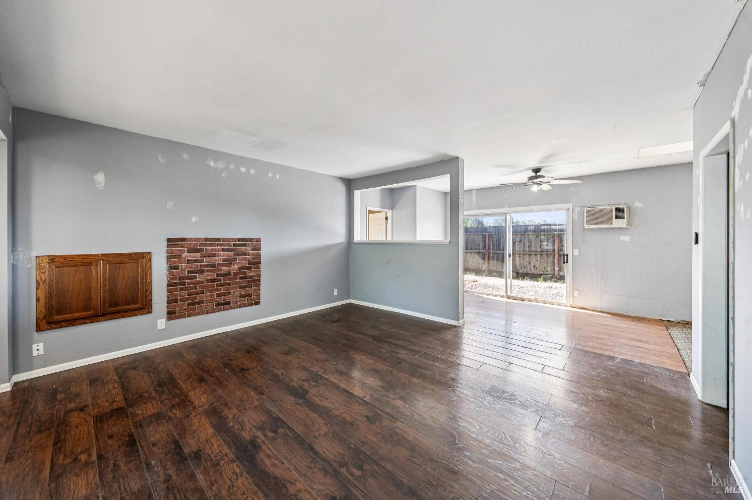 2295 Francisco Avenue, Unit 1 Santa Rosa, CA 95403 - Photo 47 of 65 a view of an empty room with wooden floor and a window