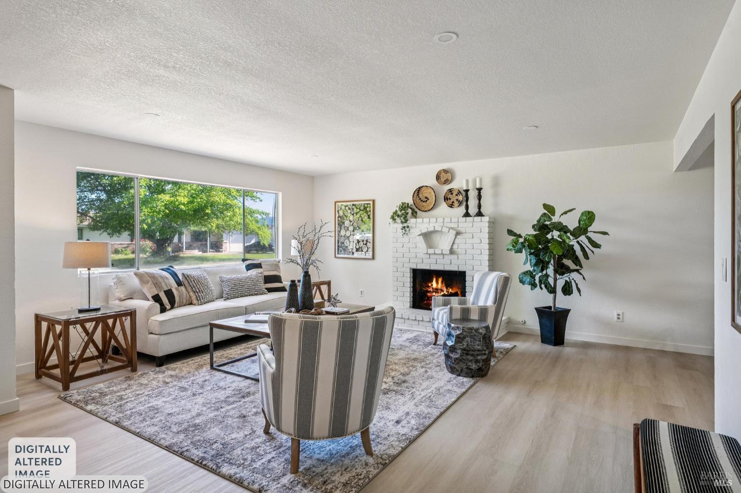2295 Francisco Avenue, Unit 1 Santa Rosa, CA 95403 - Photo 9 of 65 a living room with furniture a fireplace and potted plants