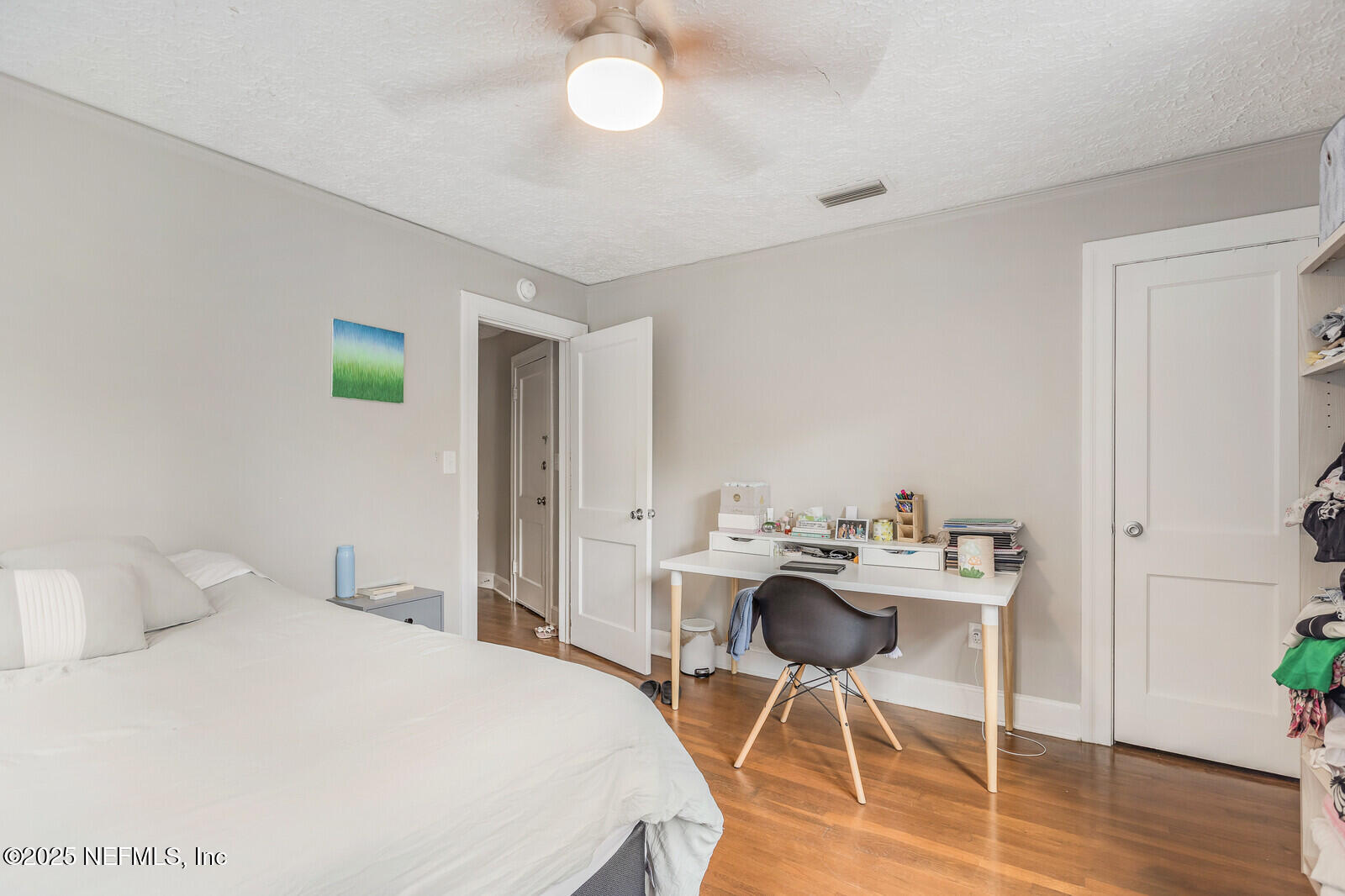 3668 Valencia Road Jacksonville, FL 32205 - Photo 21 of 23 a bedroom with a bed and a table chair