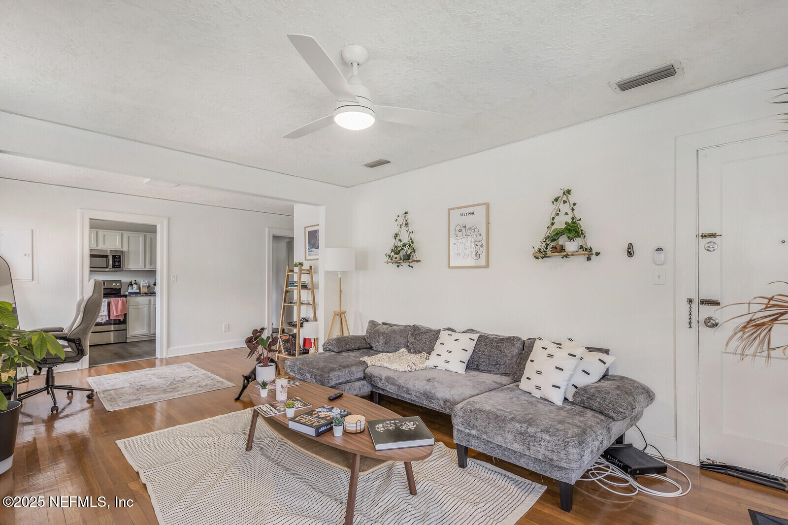 3668 Valencia Road Jacksonville, FL 32205 - Photo 8 of 23 a living room with furniture and wooden floor