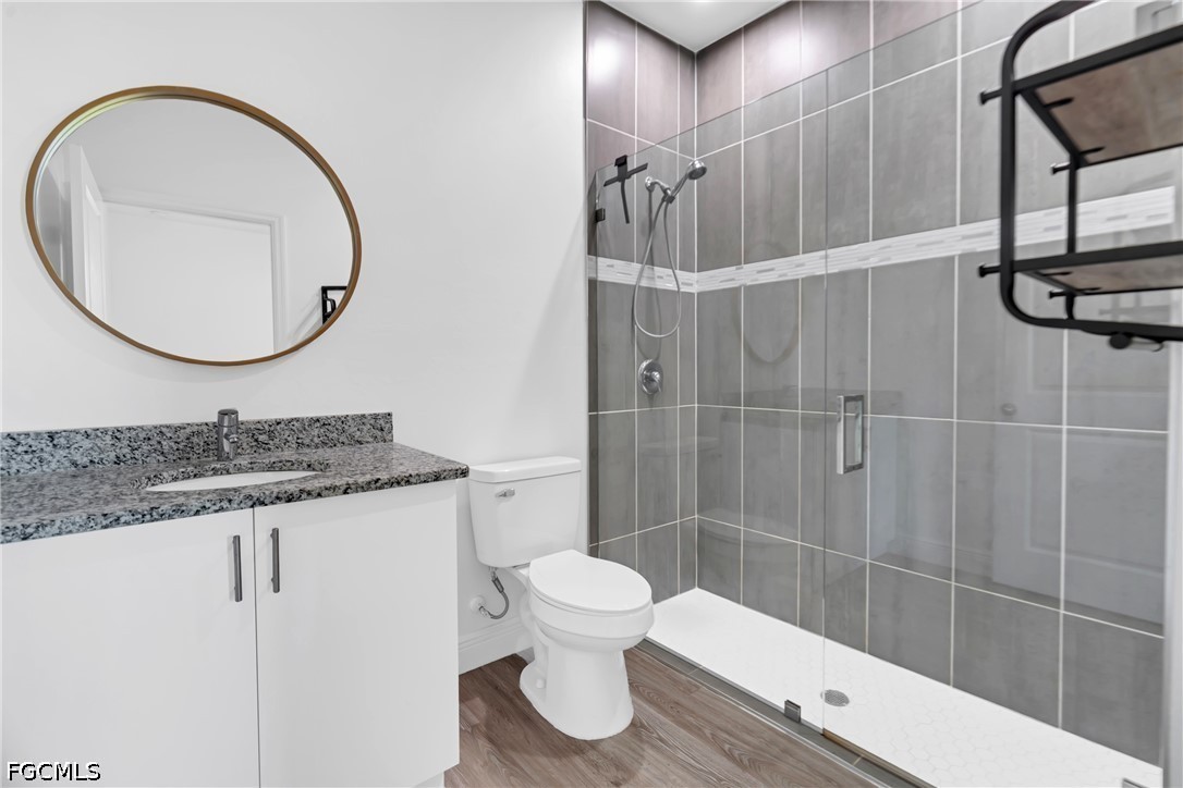 2026 Jeronimo Road LaBelle, FL 33935 - Photo 9 of 15 a bathroom with a sink a toilet and shower