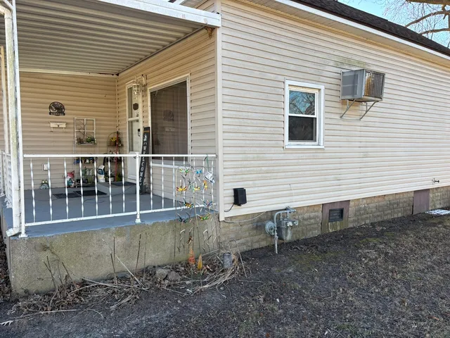 a view of a house with a yard and wooden floor