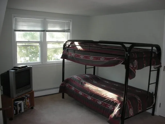 a room with gym equipment and a window