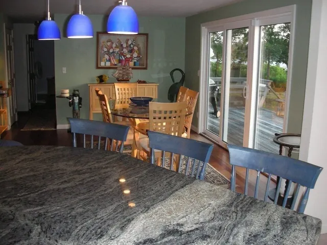 a view of a chairs and table in patio