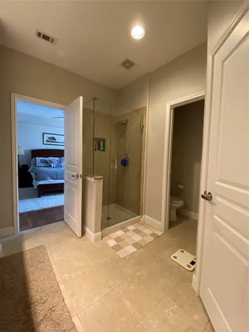 a bathroom with a shower and a tub