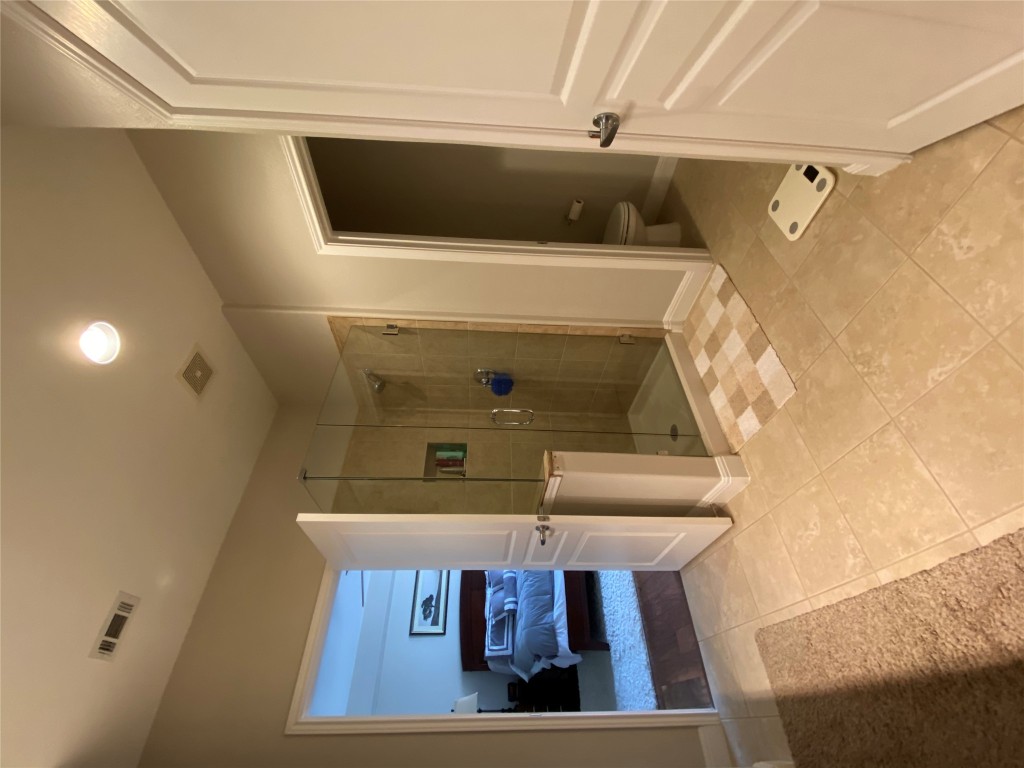 3406 Menchaca Road, Unit 24 Austin, TX 78704 - Photo 14 of 14 a bathroom with a shower and a tub