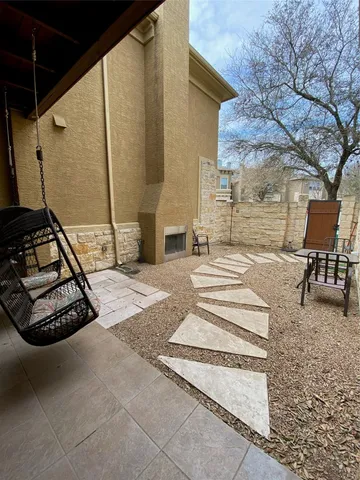 a backyard of a house with seating space