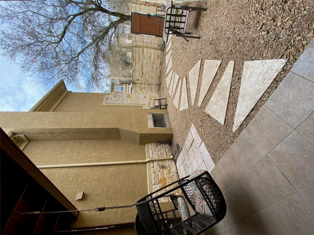 3406 Menchaca Road, Unit 24 Austin, TX 78704 - Photo 2 of 14 a backyard of a house with seating space
