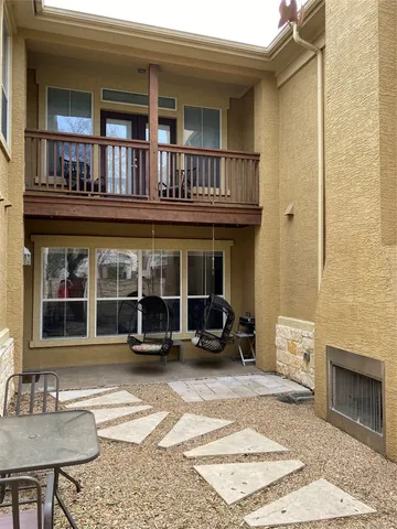a view of a brick building with many windows