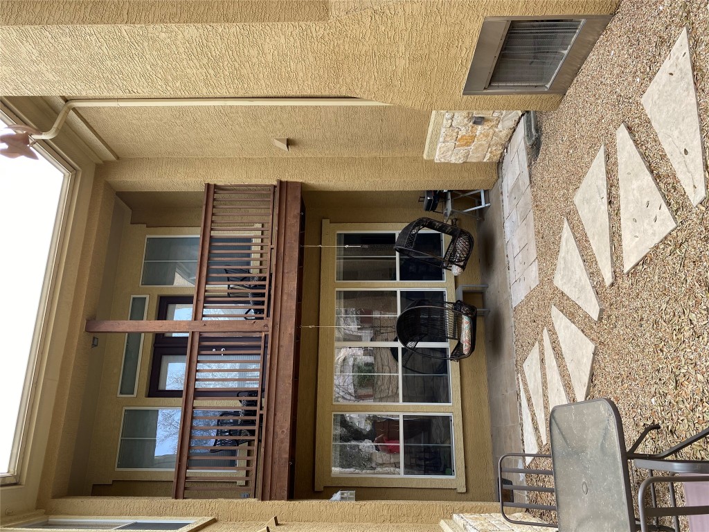 3406 Menchaca Road, Unit 24 Austin, TX 78704 - Photo 3 of 14 a view of a brick building with many windows