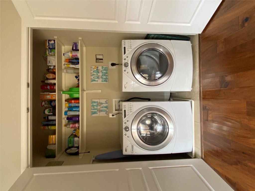 3406 Menchaca Road, Unit 24 Austin, TX 78704 - Photo 10 of 14 a view of washer and dryer in a shelf