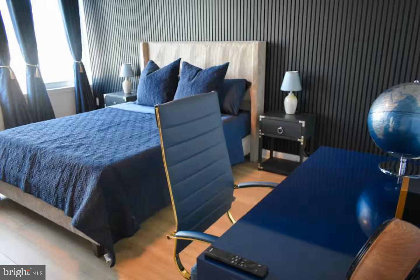 100 Harborview Drive, Unit 507 Baltimore, MD 21230 - Photo 11 of 28 a living room with furniture and wooden floor