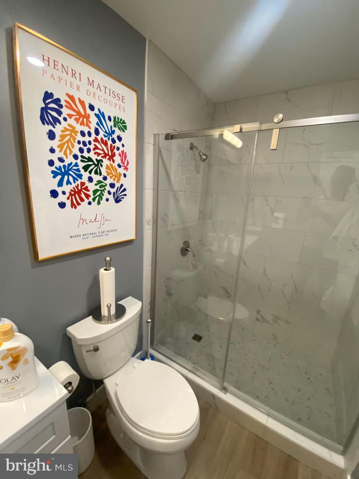 100 Harborview Drive, Unit 507 Baltimore, MD 21230 - Photo 15 of 28 a bathroom with a toilet and a shower curtain