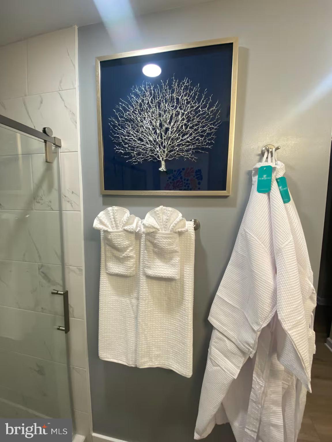 100 Harborview Drive, Unit 507 Baltimore, MD 21230 - Photo 16 of 28 a view of a painting on the wall in a bathroom