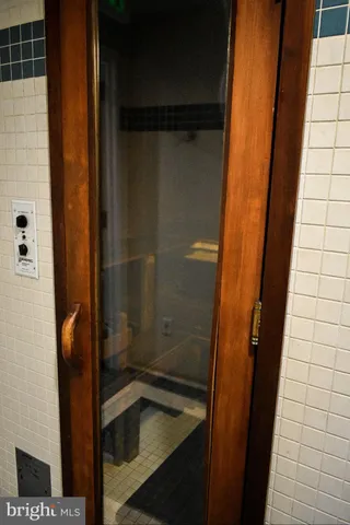 a view of a room with wooden walls