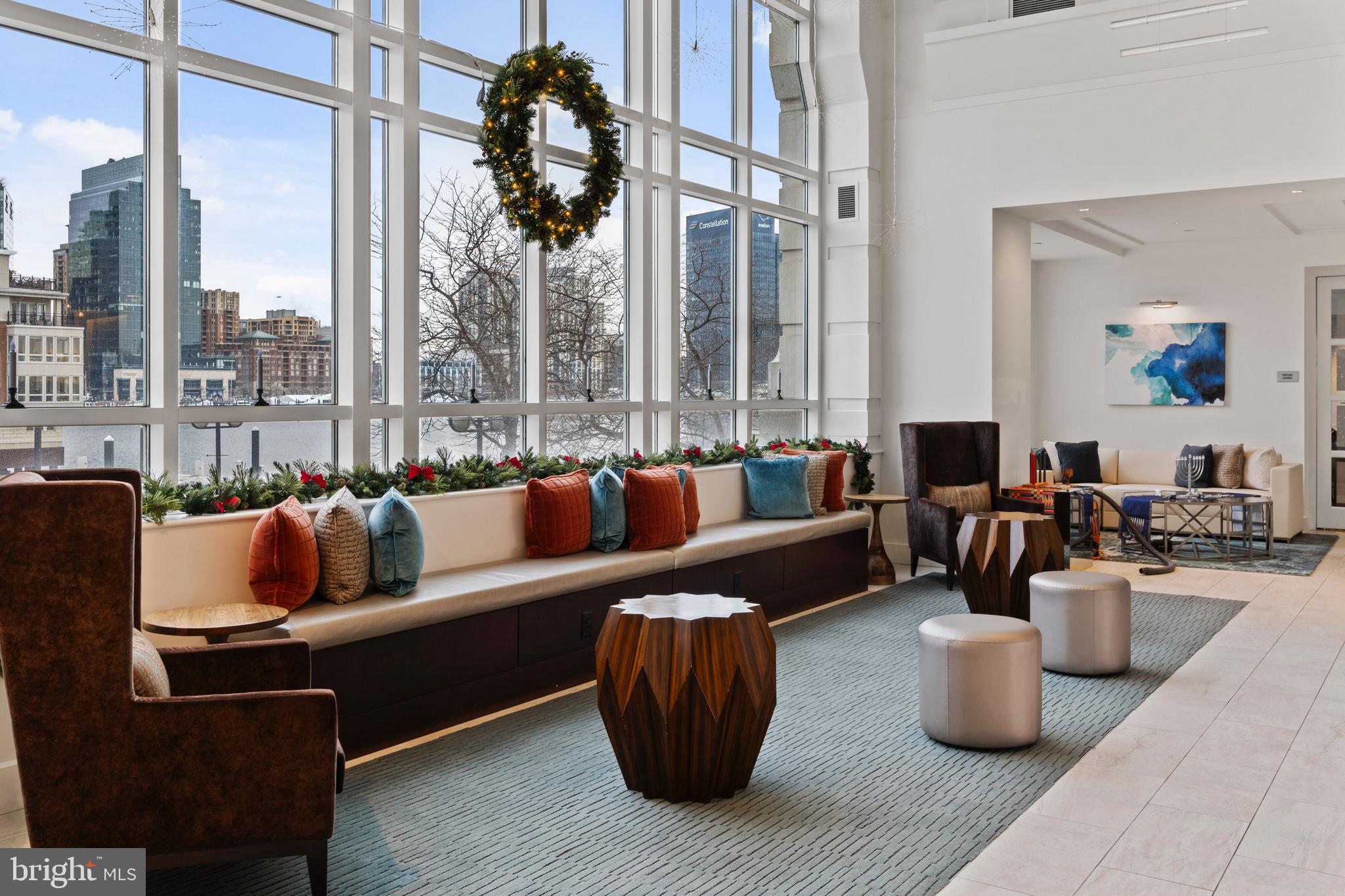 100 Harborview Drive, Unit 507 Baltimore, MD 21230 - Photo 25 of 28 a living room with furniture and a large window