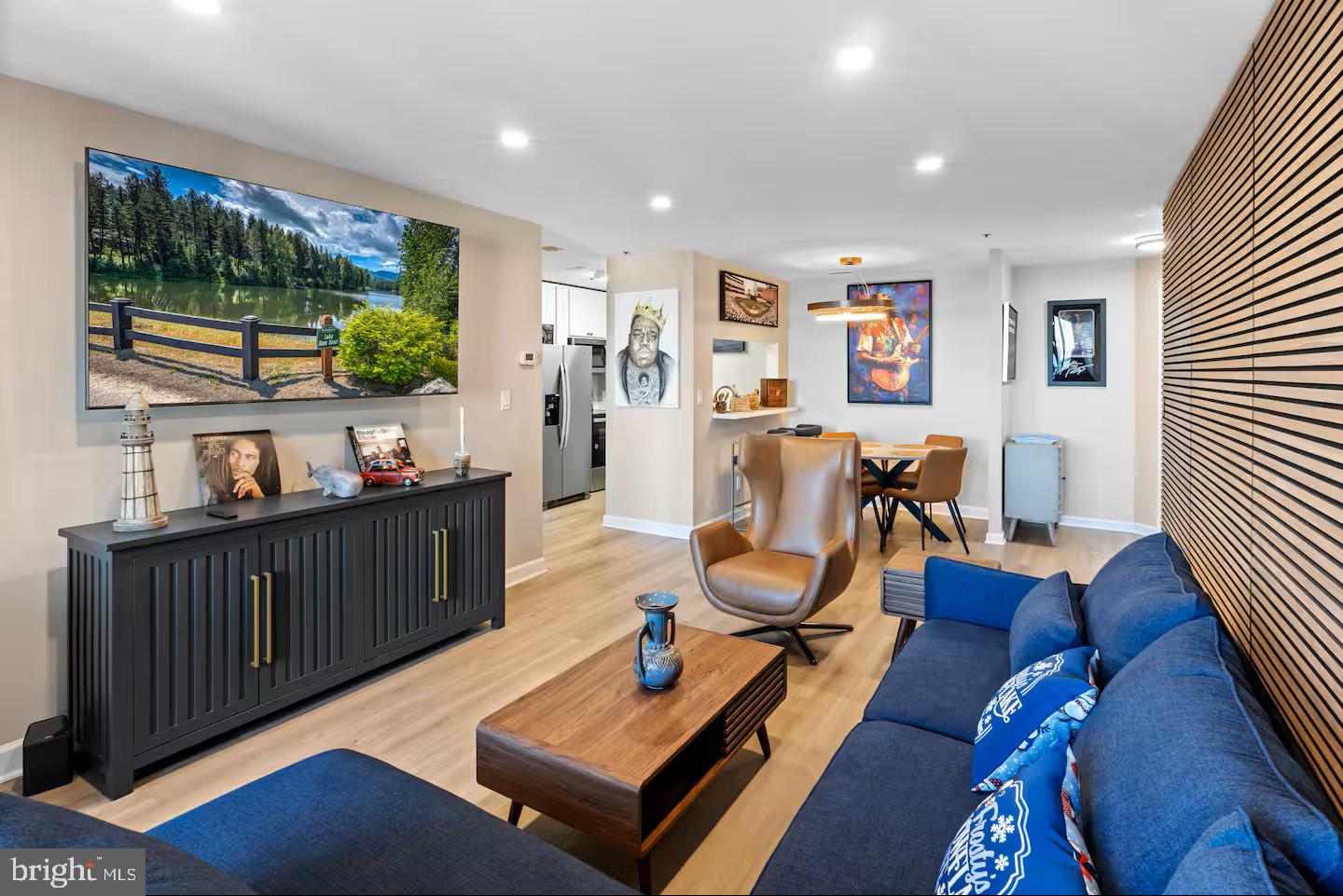 100 Harborview Drive, Unit 507 Baltimore, MD 21230 - Photo 4 of 28 a living room with furniture and a flat screen tv