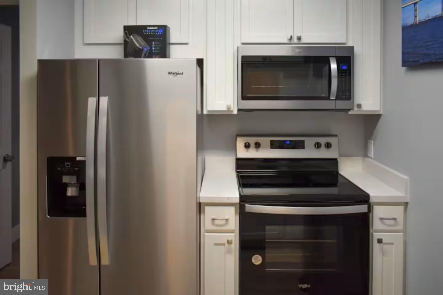 100 Harborview Drive, Unit 507 Baltimore, MD 21230 - Photo 8 of 28 a kitchen with stainless steel appliances a refrigerator stove and microwave