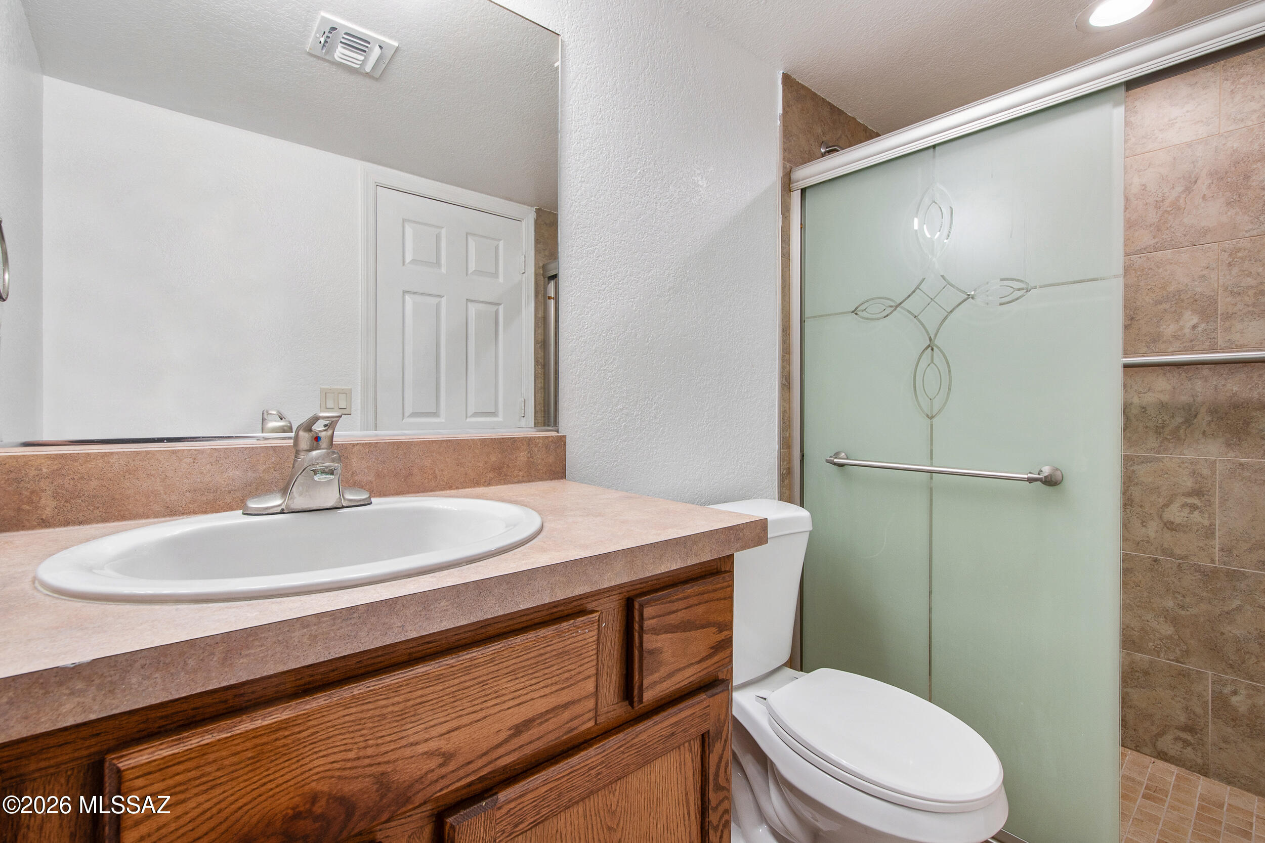 5855 North Kolb Road, Unit 6103 Tucson, AZ 85750 - Photo 15 of 31 a bathroom with a sink a toilet and shower