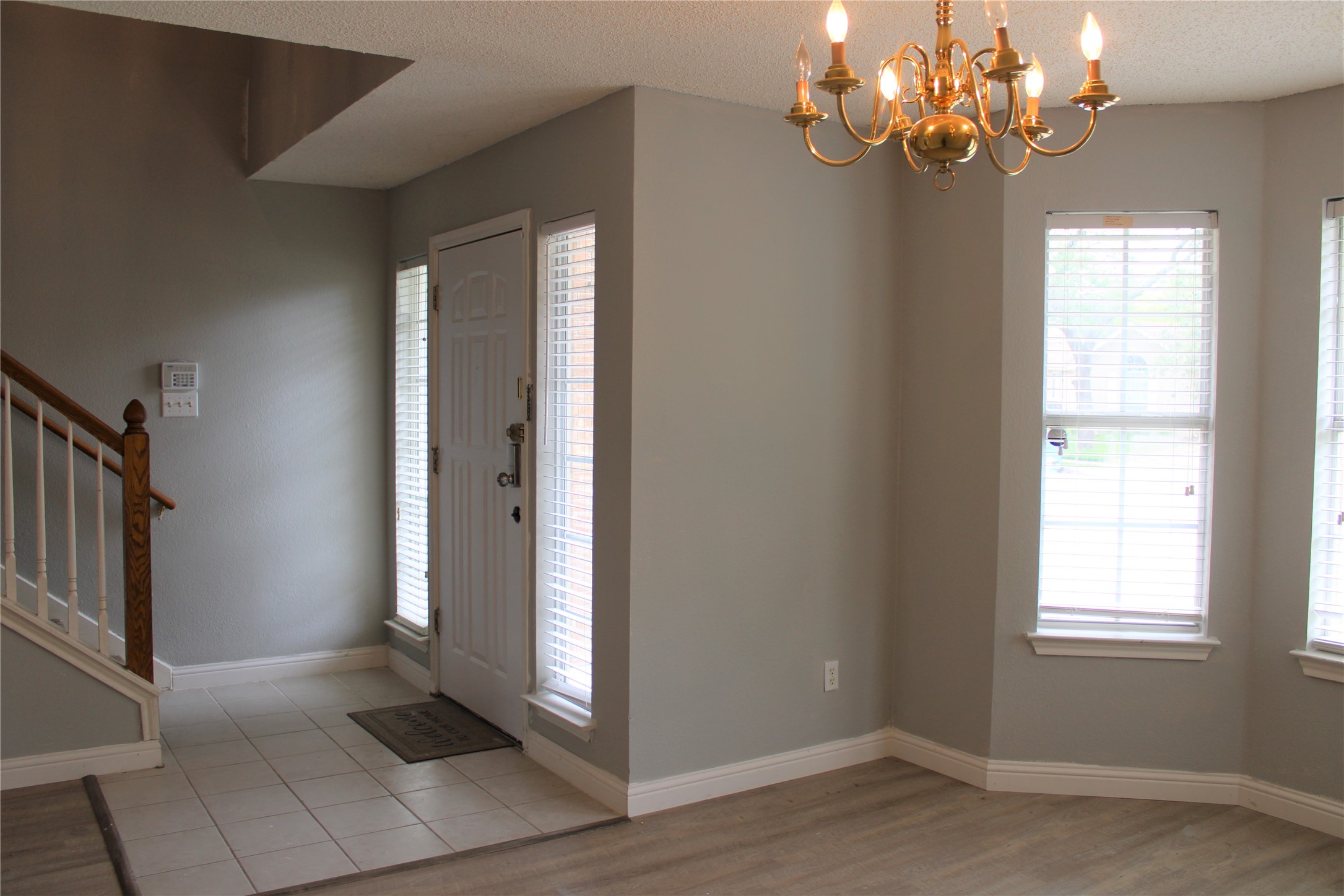 16205 Glorious Lane Pflugerville, TX 78660 - Photo 3 of 30 a view of a livingroom with a chandelier fan and windows