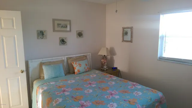 a bathroom with a granite countertop toilet and a sink