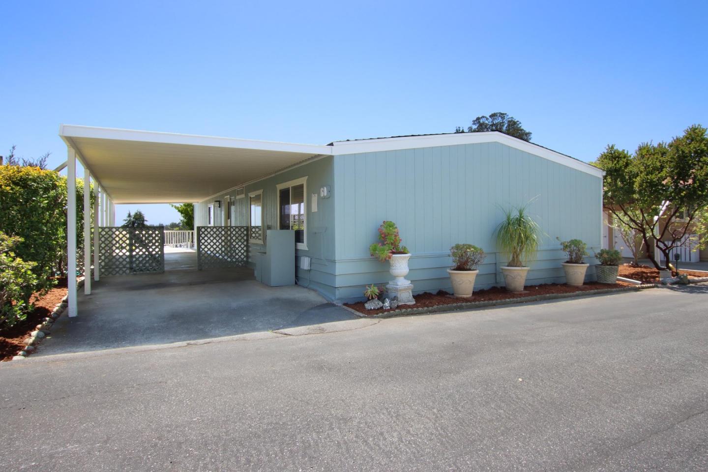 a view of a house with outdoor space and a garage