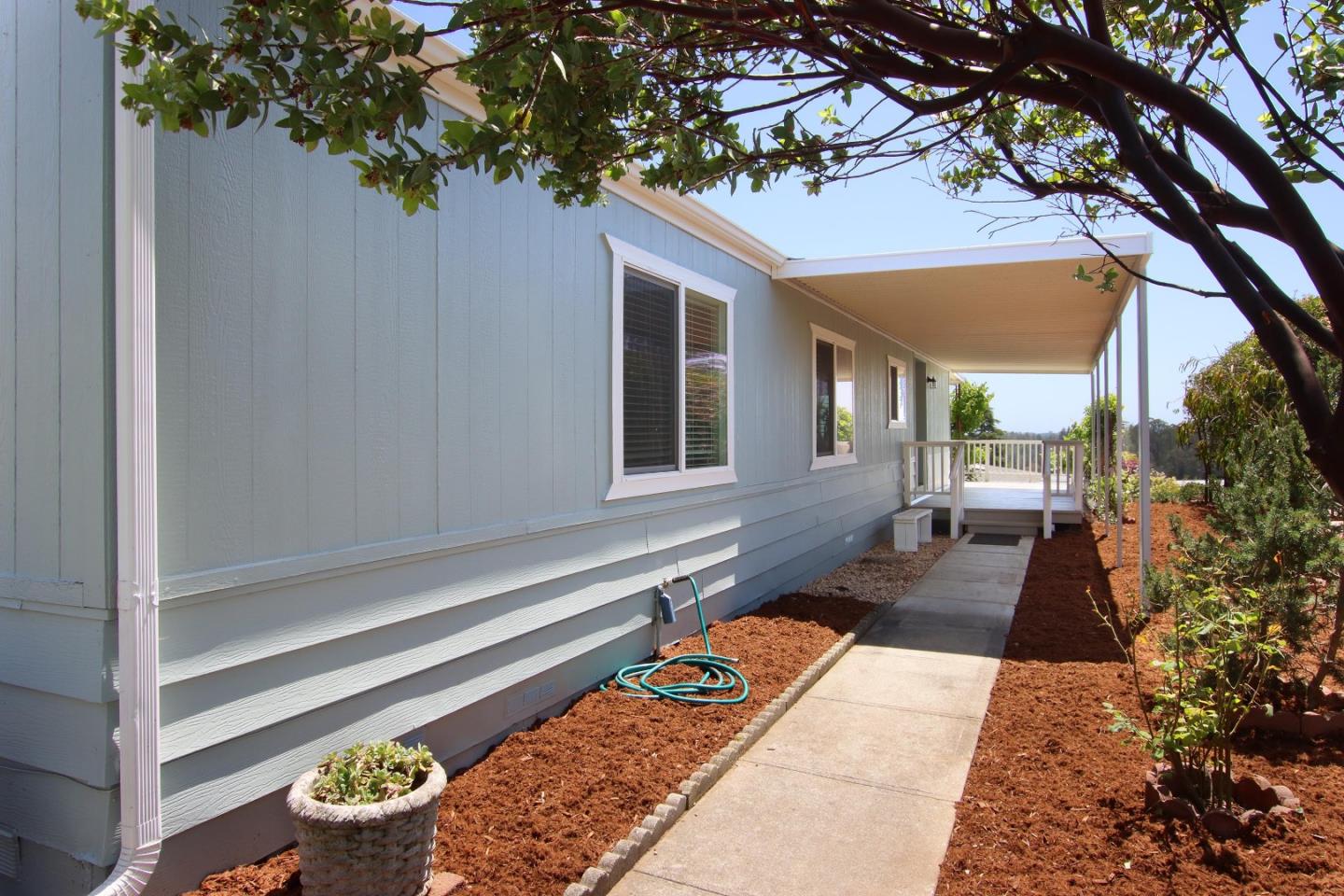 270 Hames Road, Unit 60 Corralitos, CA 95076 - Photo 12 of 32 a front view of a house with a yard