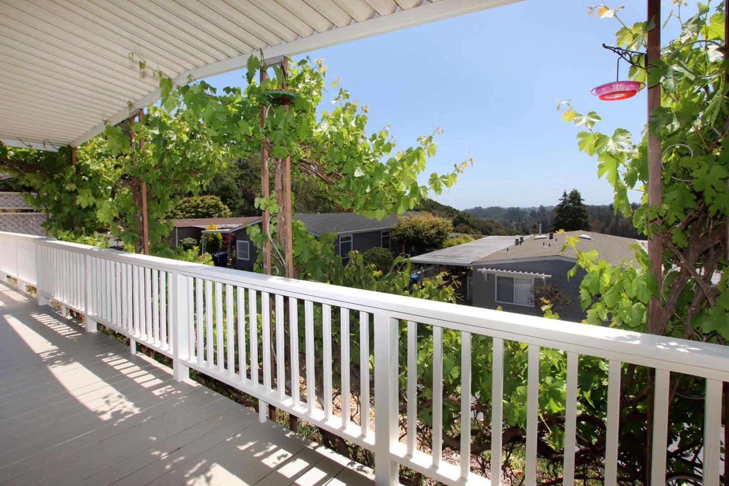 270 Hames Road, Unit 60 Corralitos, CA 95076 - Photo 13 of 32 a view of a balcony with flower plants