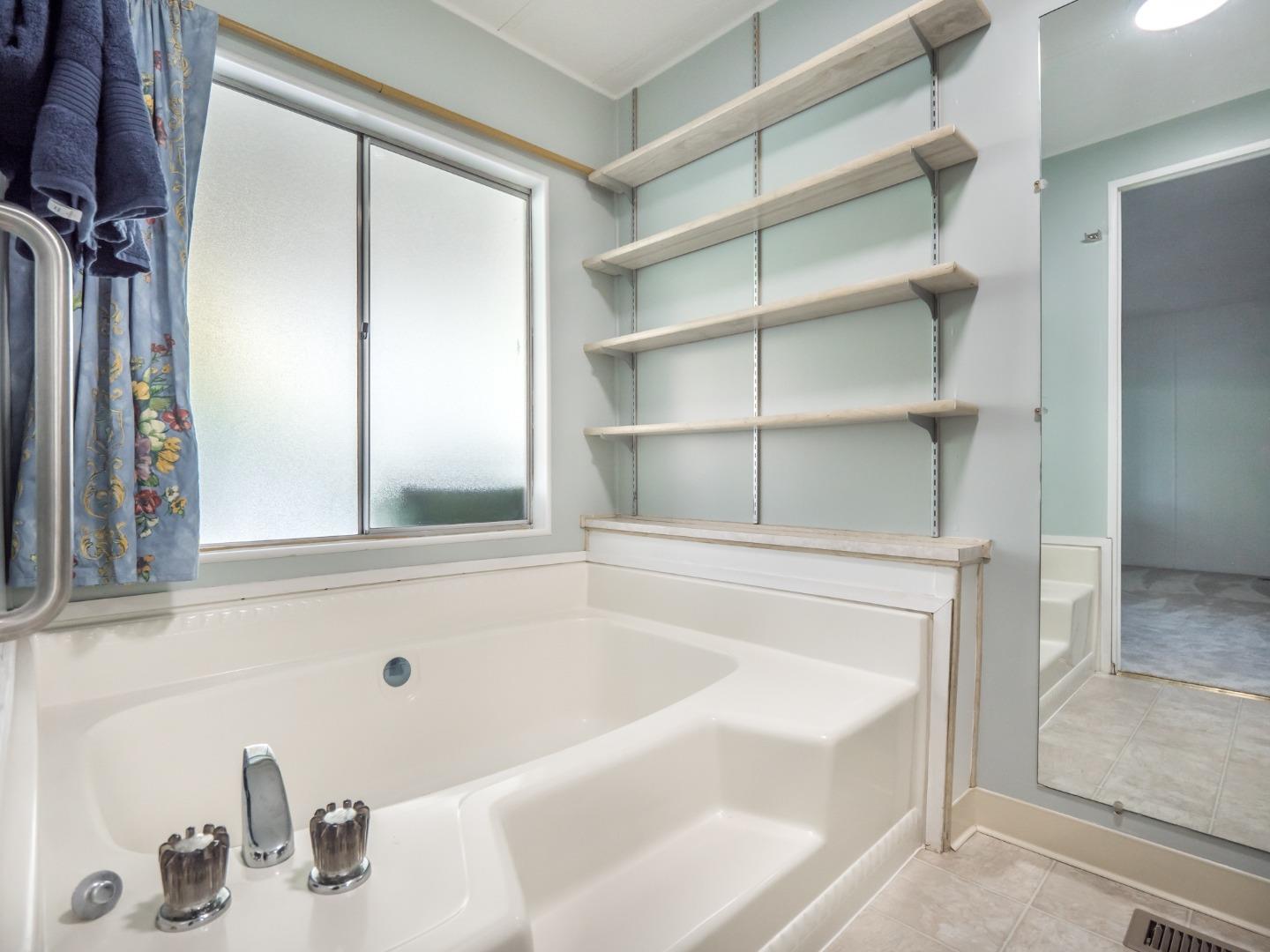 270 Hames Road, Unit 60 Corralitos, CA 95076 - Photo 15 of 32 a white bath tub sitting next to a window
