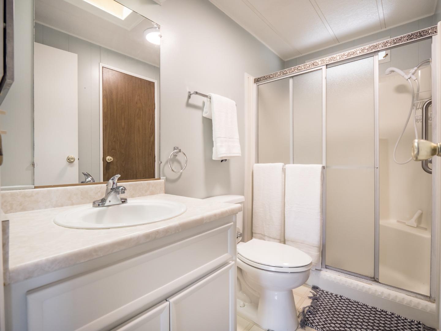 270 Hames Road, Unit 60 Corralitos, CA 95076 - Photo 18 of 32 a bathroom with a sink toilet and shower