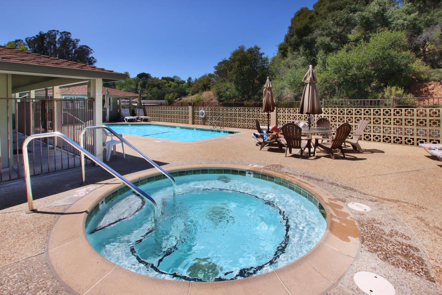 270 Hames Road, Unit 60 Corralitos, CA 95076 - Photo 21 of 32 a view of a swimming pool with a sitting space