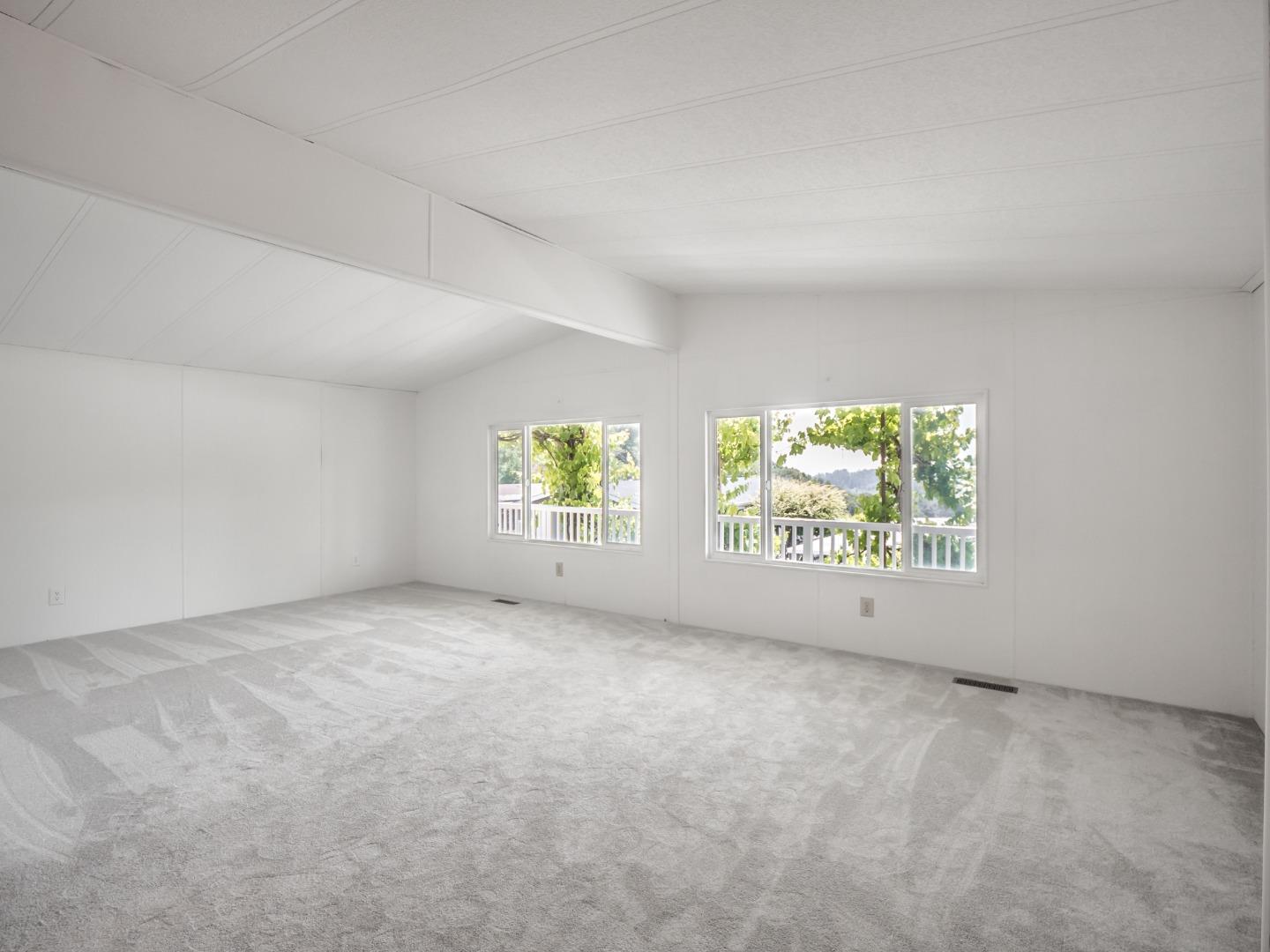 270 Hames Road, Unit 60 Corralitos, CA 95076 - Photo 29 of 32 an empty room with windows