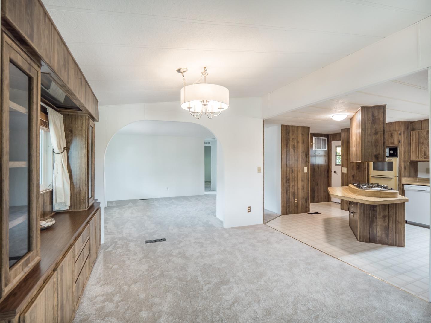 270 Hames Road, Unit 60 Corralitos, CA 95076 - Photo 30 of 32 a view of a living room and chandelier