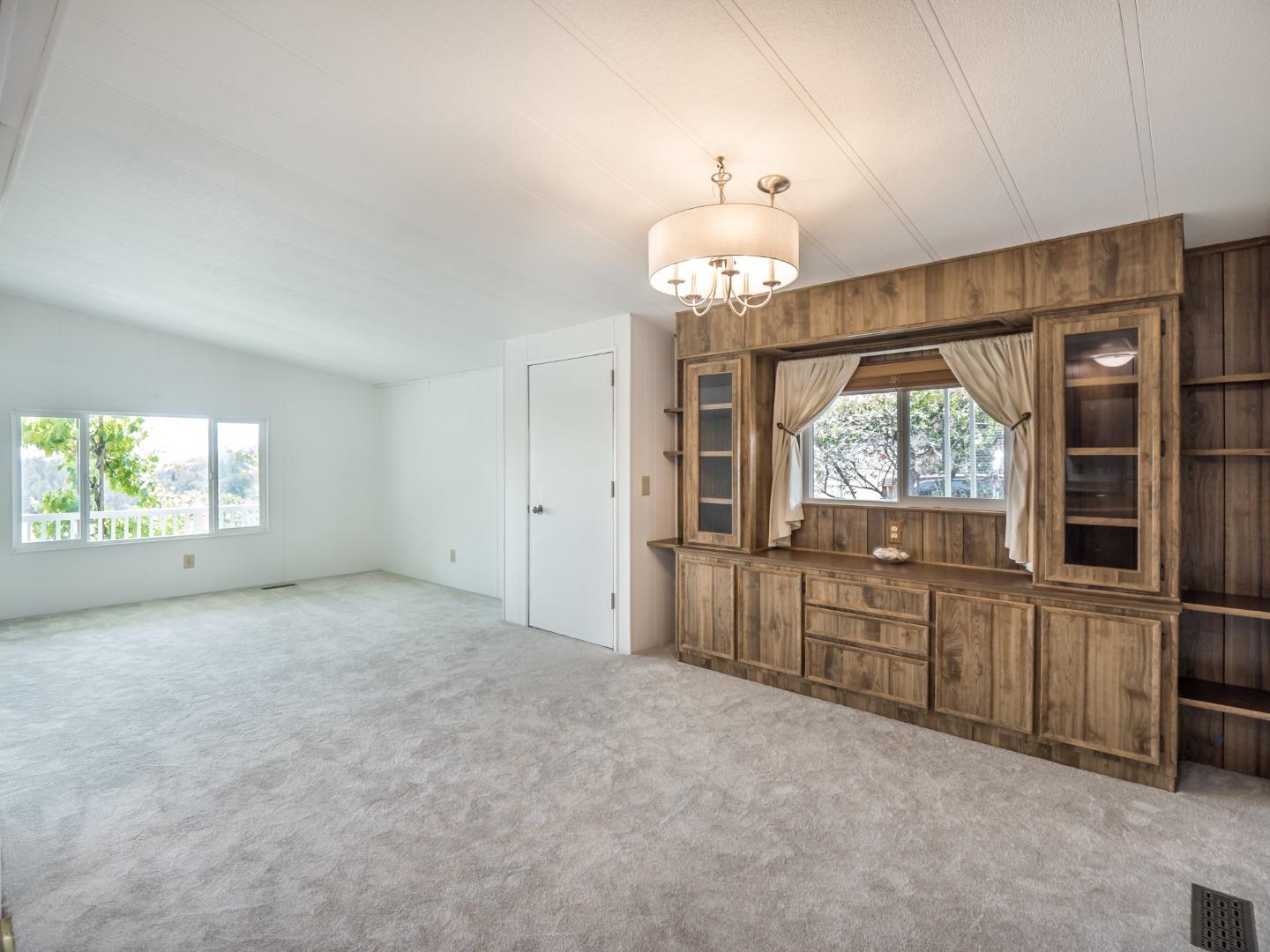 270 Hames Road, Unit 60 Corralitos, CA 95076 - Photo 31 of 32 wooden floor in an empty room with a window