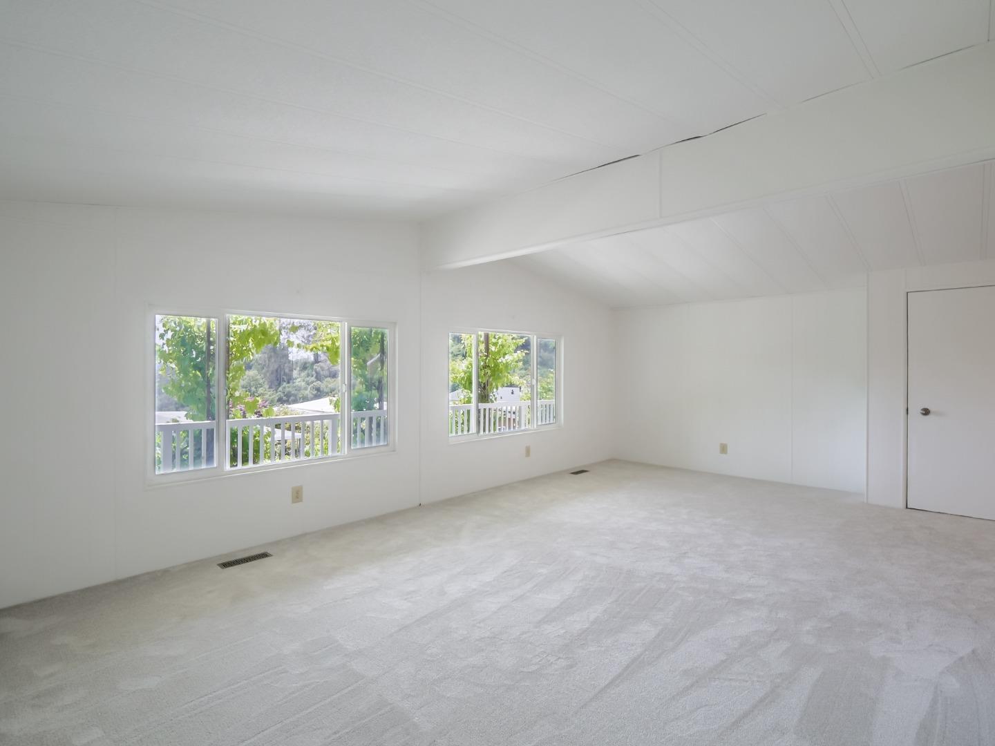 270 Hames Road, Unit 60 Corralitos, CA 95076 - Photo 8 of 32 an empty room with windows