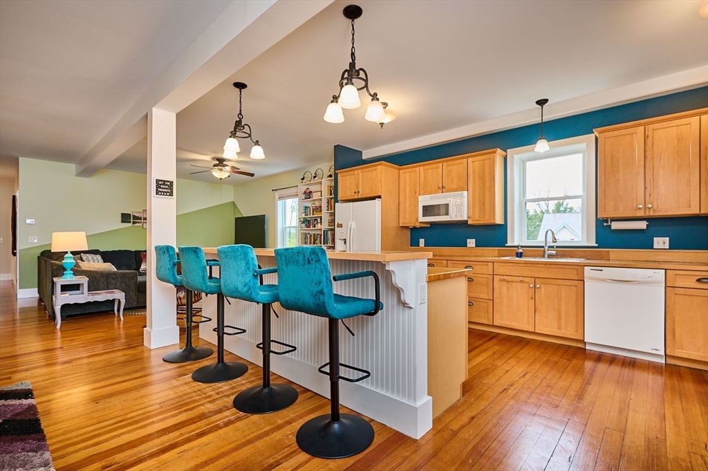 12 A Parker Avenue, Unit 1 Northfield, MA 01360 - Photo 2 of 28 a kitchen with stainless steel appliances granite countertop wooden floors and large window