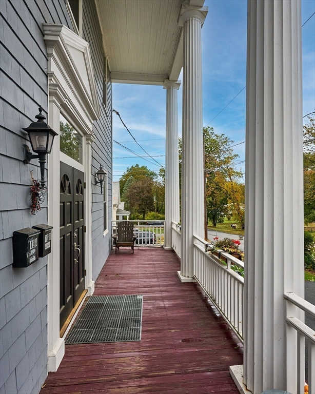 12 A Parker Avenue, Unit 1 Northfield, MA 01360 - Photo 22 of 28 a view of a balcony with wooden floor and stairs