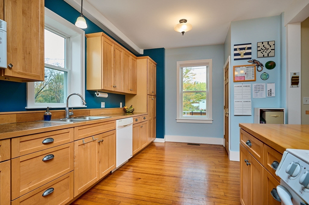 12 A Parker Avenue, Unit 1 Northfield, MA 01360 - Photo 5 of 28 a kitchen with stainless steel appliances a sink stove and cabinets