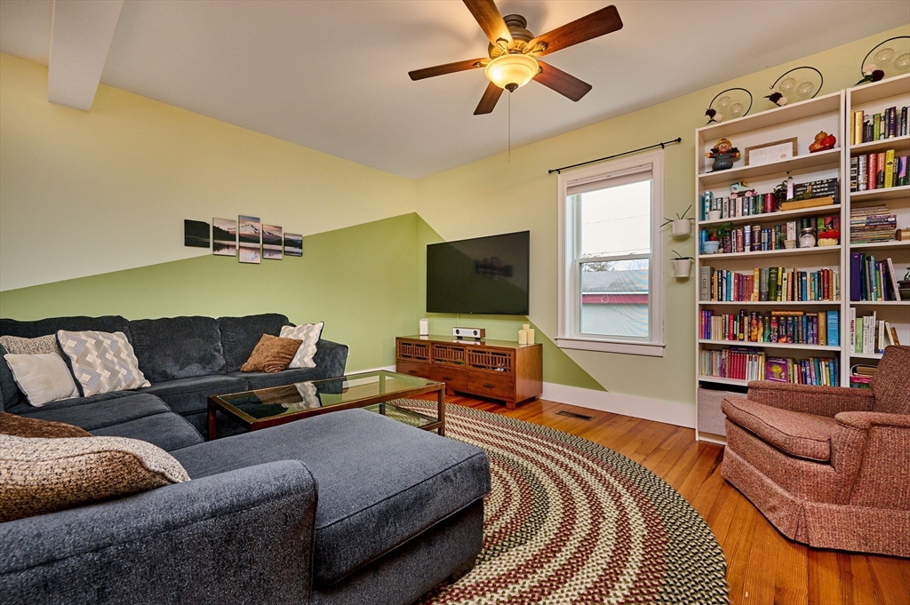 12 A Parker Avenue, Unit 1 Northfield, MA 01360 - Photo 8 of 28 a living room with furniture and a flat screen tv