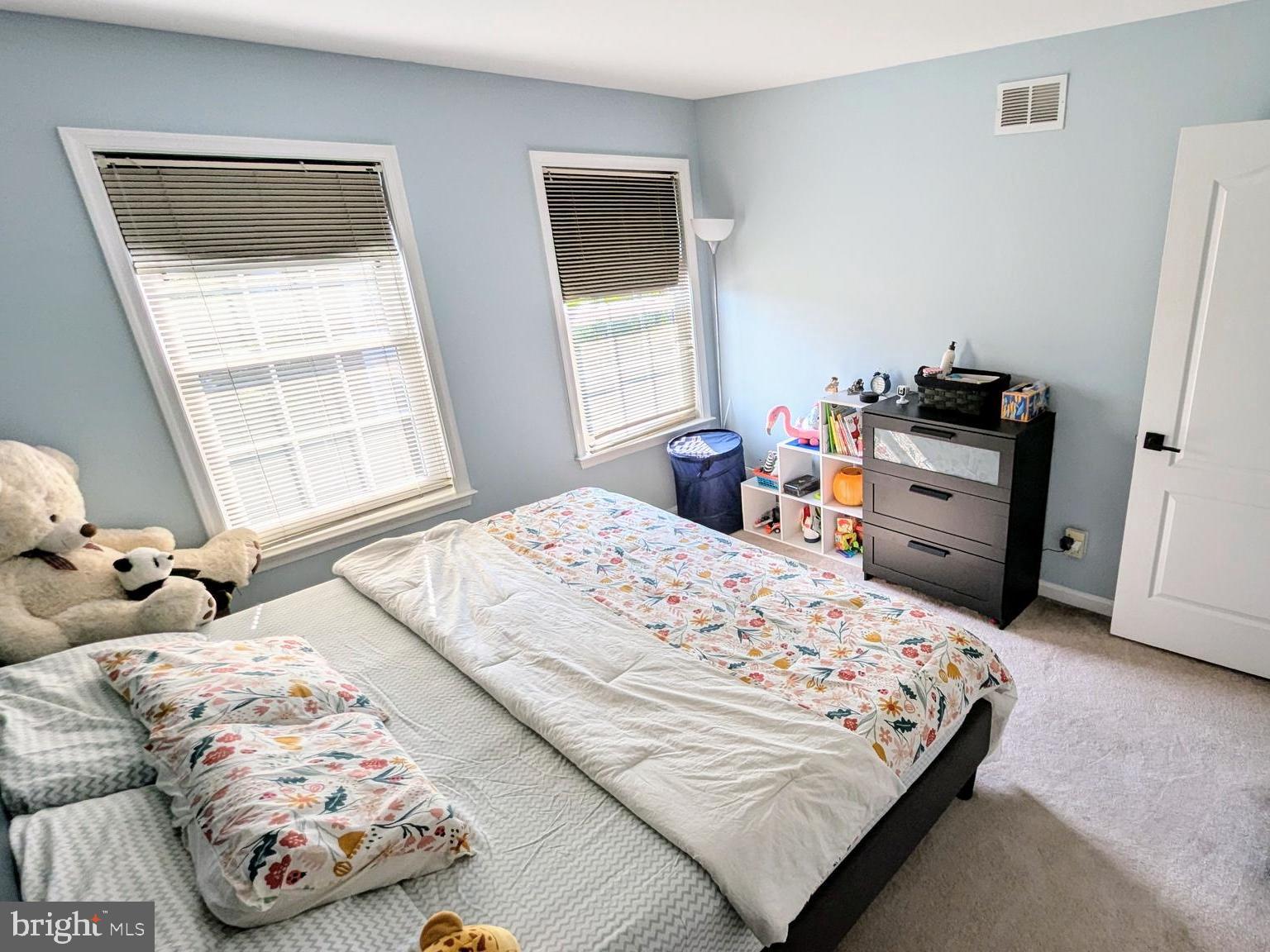 20867 Trinity Square Sterling, VA 20165 - Photo 13 of 19 a bedroom with a bed and a window