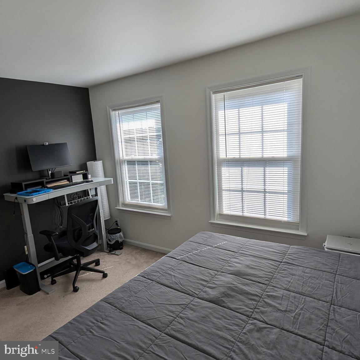 20867 Trinity Square Sterling, VA 20165 - Photo 14 of 19 a bedroom with a bed and a window